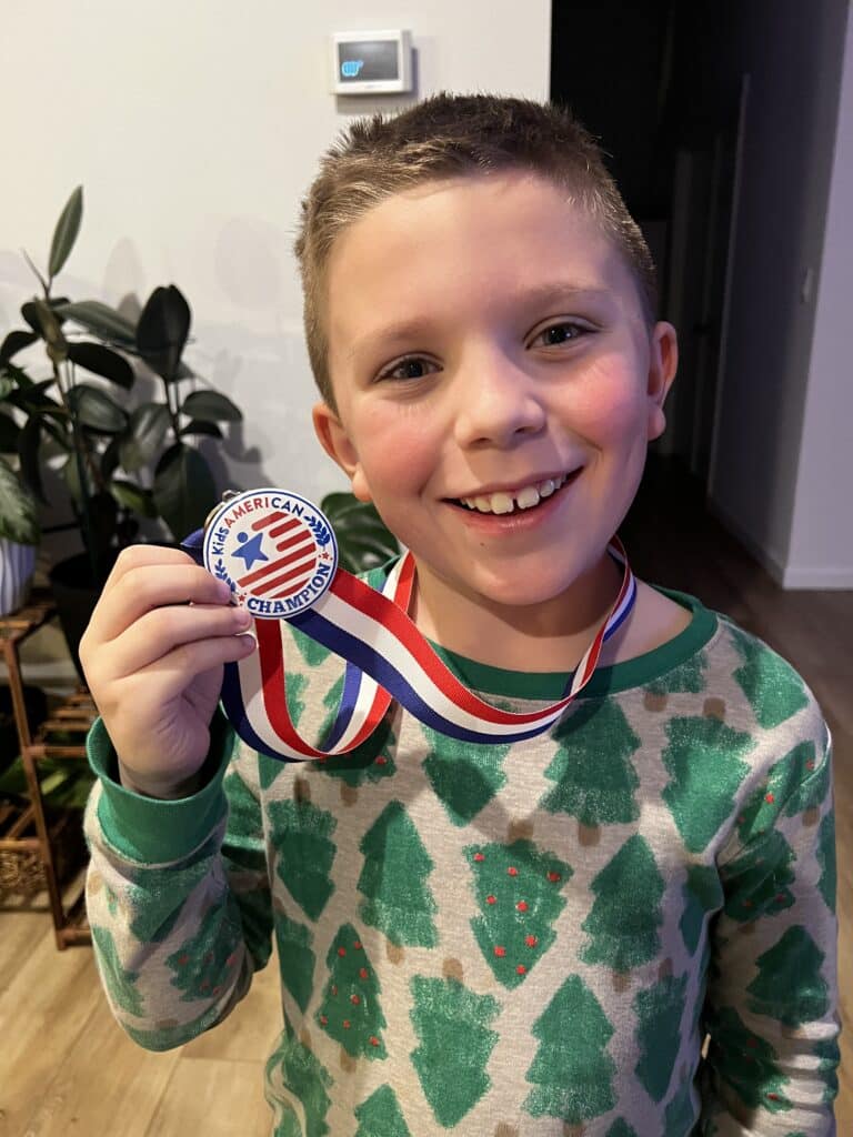 kid with medal